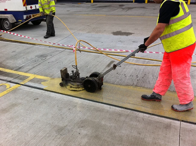 Line marking removal from block paving car park surface using UHP water jetting RGL Services