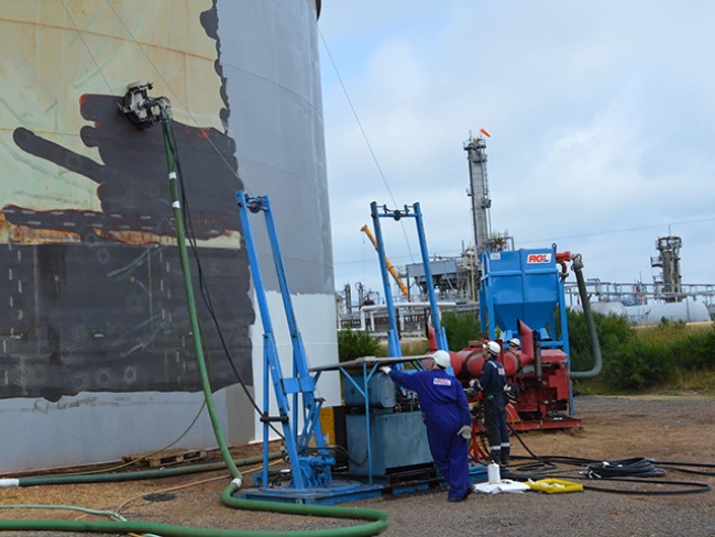 Robotic steel surface preparation removing coatings from process vessel